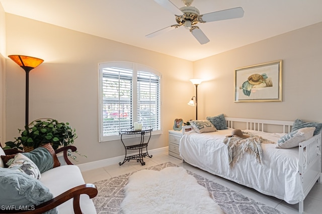 bedroom with light tile patterned flooring and ceiling fan