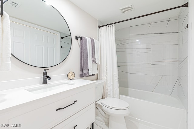 full bathroom with vanity, shower / bath combo with shower curtain, and toilet