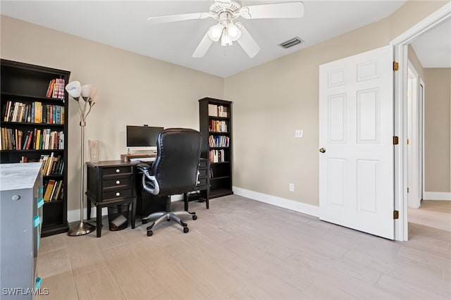 office area featuring light hardwood / wood-style floors and ceiling fan