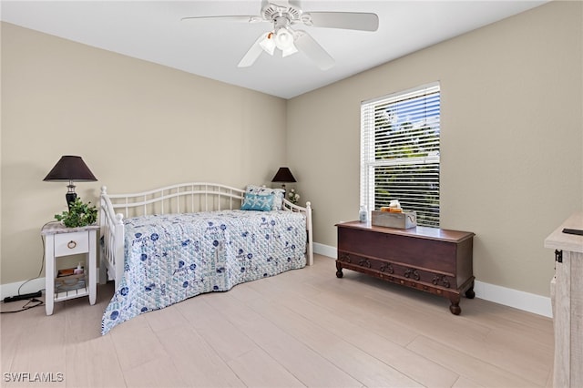 bedroom featuring light hardwood / wood-style floors and ceiling fan