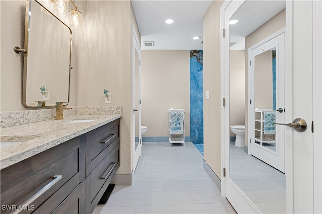 bathroom with vanity and toilet