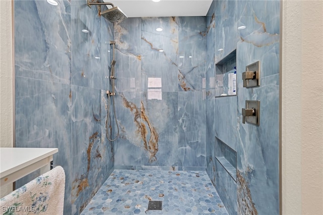 bathroom featuring a tile shower