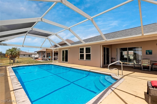 view of swimming pool with a patio and glass enclosure