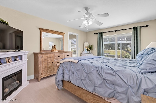 bedroom featuring ceiling fan and light hardwood / wood-style floors