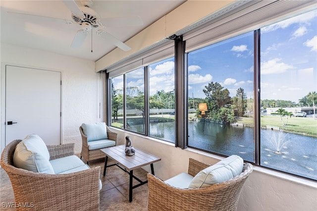 interior space featuring ceiling fan and a water view