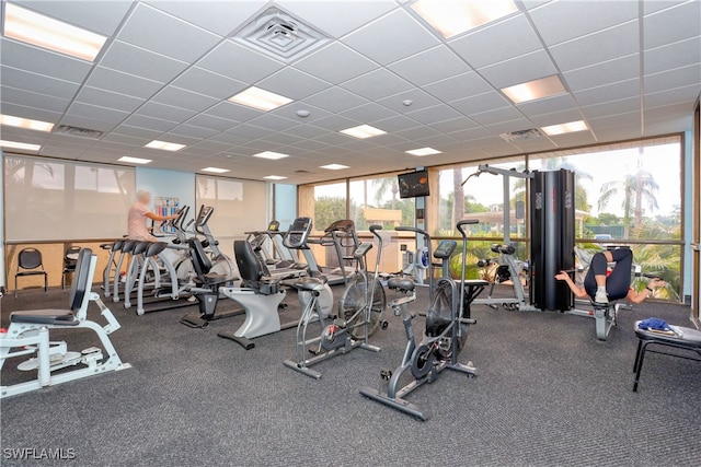 exercise room with a drop ceiling