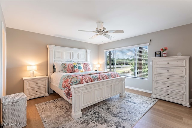 bedroom featuring ceiling fan and light hardwood / wood-style floors