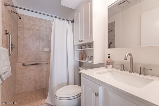 bathroom featuring curtained shower, vanity, and toilet