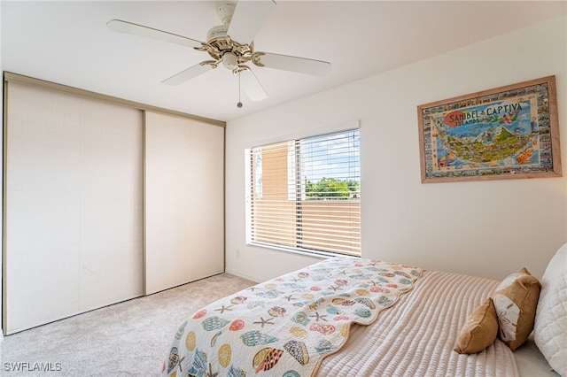 bedroom with ceiling fan and light colored carpet