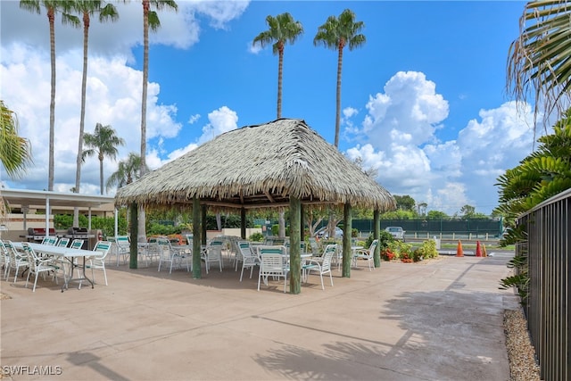 surrounding community with a gazebo and a patio area