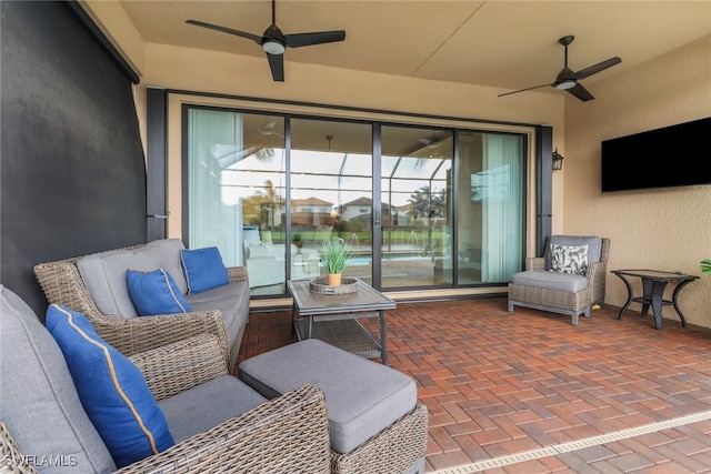 view of patio featuring ceiling fan and an outdoor living space