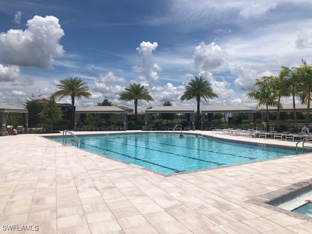 view of swimming pool with a patio area and a gazebo