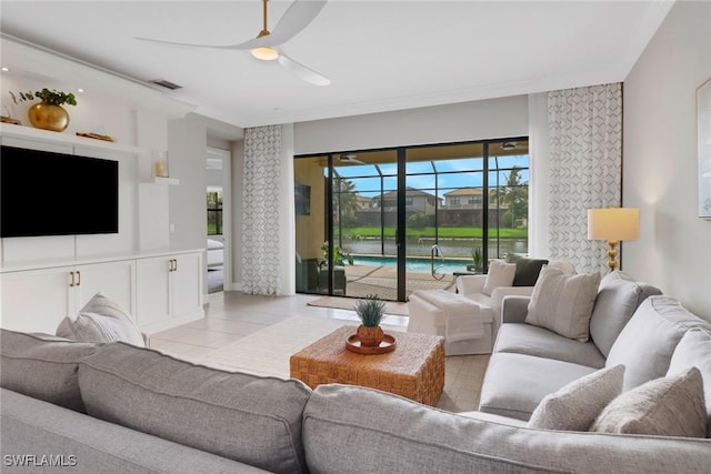 living room featuring ceiling fan and light tile patterned flooring