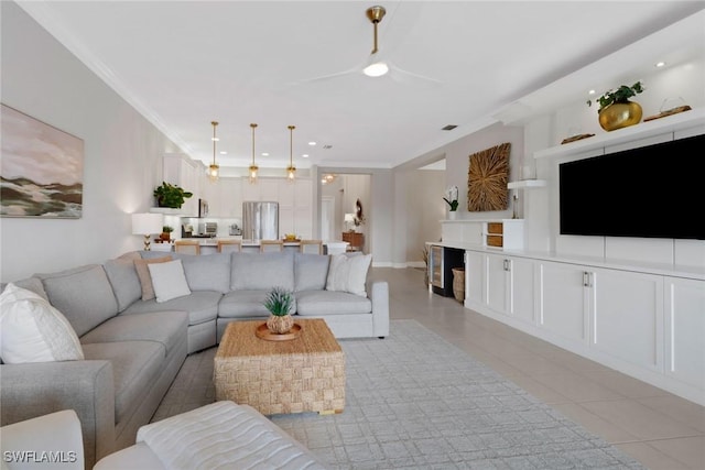 tiled living room with built in features and crown molding