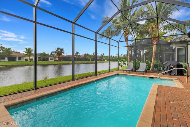 view of swimming pool featuring a water view, glass enclosure, area for grilling, and a patio area