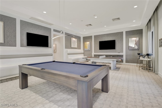 playroom with a raised ceiling and billiards