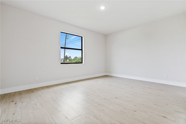 unfurnished room featuring light wood-type flooring