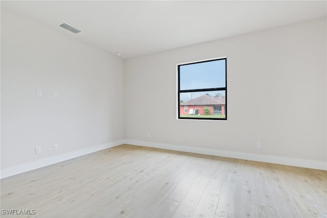 spare room featuring light wood-type flooring