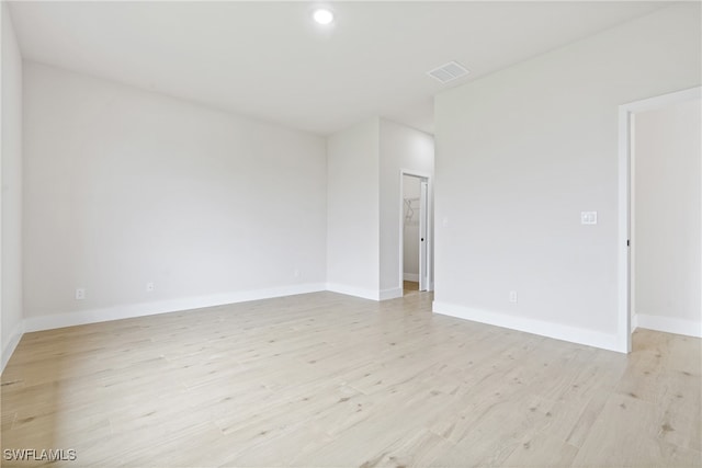 spare room featuring light hardwood / wood-style floors