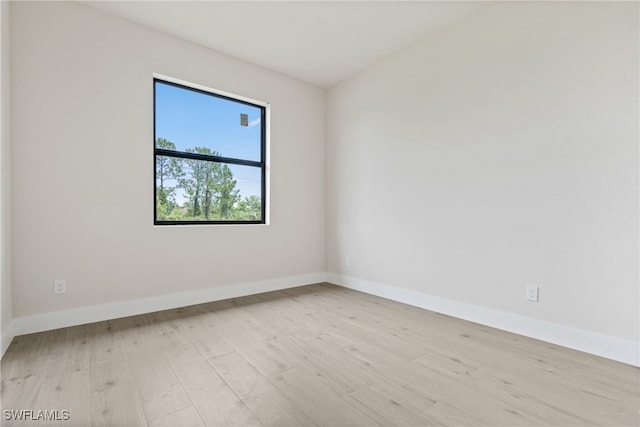 spare room featuring light wood-type flooring