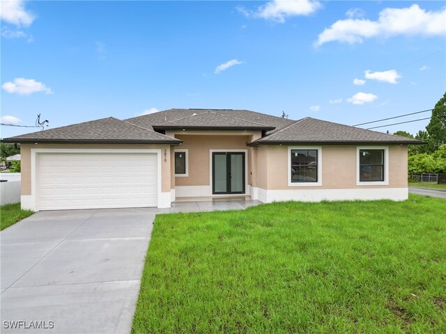 view of front facade featuring a front lawn and a garage