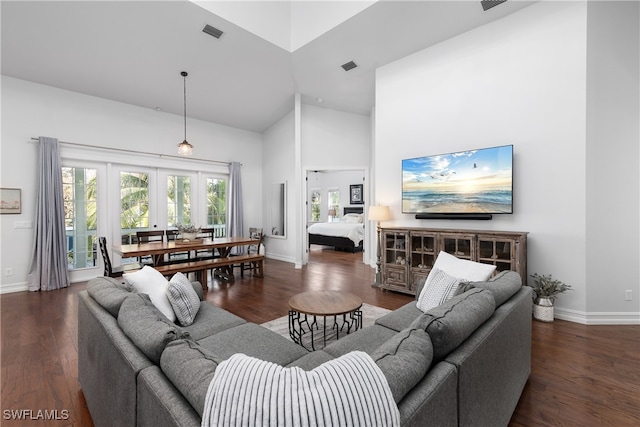 living room featuring french doors, high vaulted ceiling, and dark hardwood / wood-style flooring