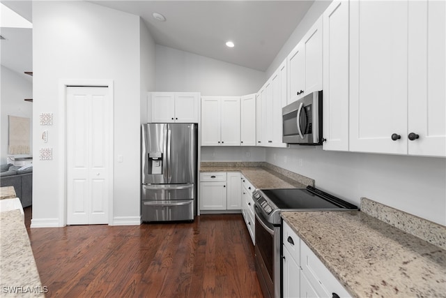 kitchen with light stone counters, stainless steel appliances, dark hardwood / wood-style flooring, and white cabinets