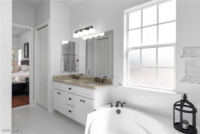 27232 J C Ln, Bonita Springs, FL 34135 - ensuite bathroom featuring double vanity and a garden tub