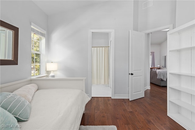 bedroom featuring dark wood-type flooring