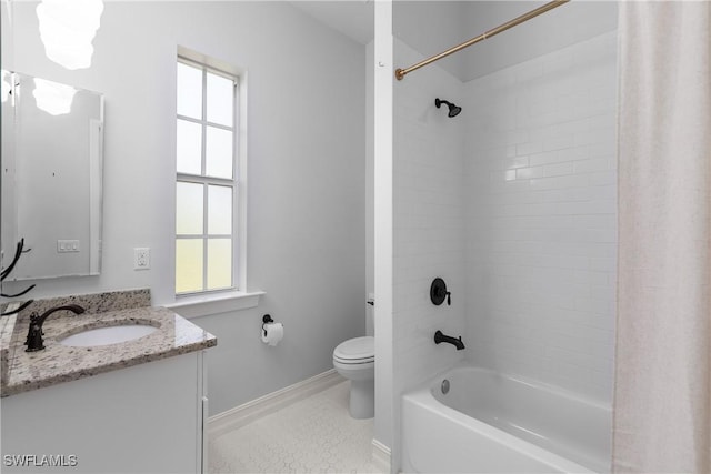 27232 J C Ln, Bonita Springs, FL 34135 - full bathroom featuring vanity, toilet,  shower combination, baseboards, and healthy amount of natural light