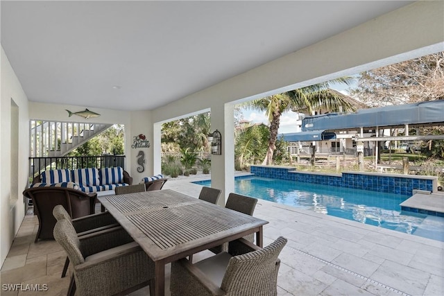 27232 J C Ln, Bonita Springs, FL 34135 - swimming pool with stairway, a patio, and outdoor dining space