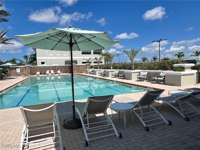 view of swimming pool with a patio