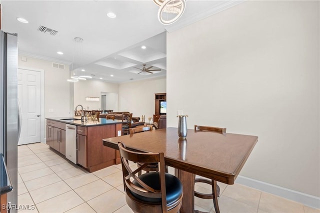 kitchen featuring stainless steel appliances, sink, ceiling fan, coffered ceiling, and crown molding