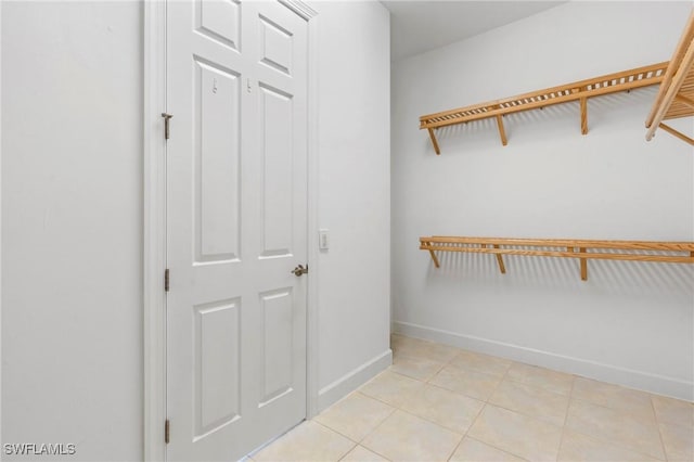 spacious closet with light tile patterned flooring