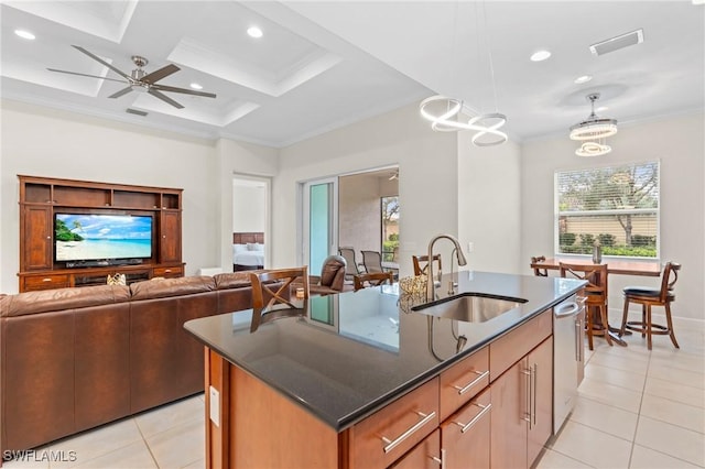 kitchen featuring coffered ceiling, an island with sink, sink, decorative light fixtures, and stainless steel dishwasher