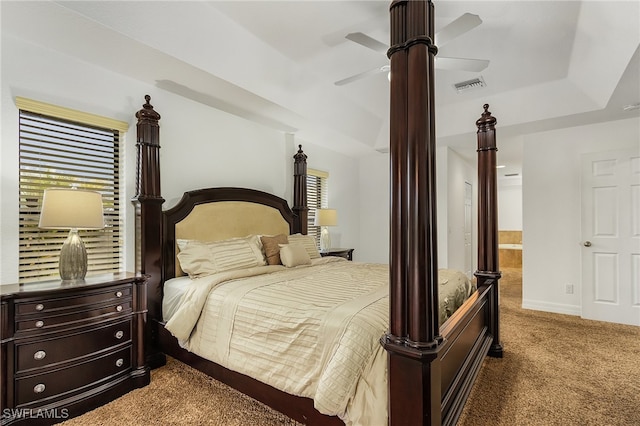 bedroom with ceiling fan, carpet, and ensuite bathroom