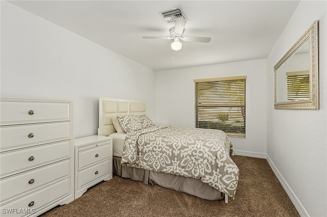 bedroom with dark colored carpet and ceiling fan