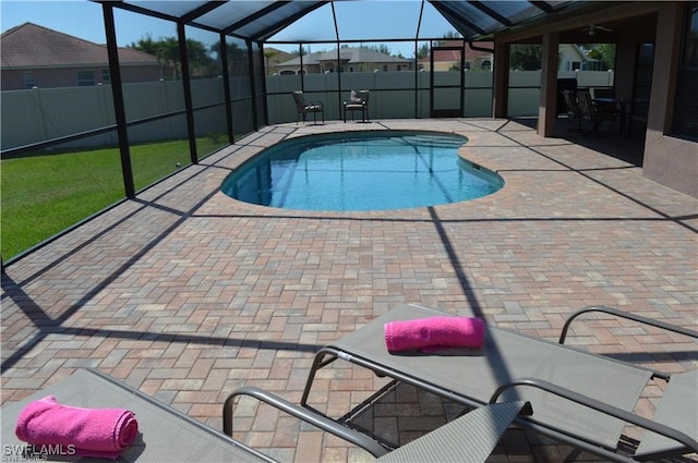 view of pool featuring a patio area and a lanai