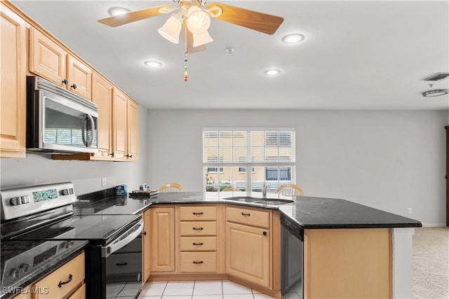 kitchen featuring stainless steel appliances, light tile patterned floors, light brown cabinetry, sink, and kitchen peninsula