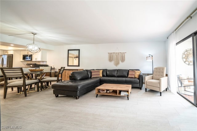 living area featuring a chandelier