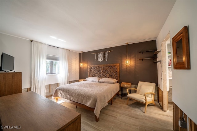 bedroom featuring light wood-style flooring