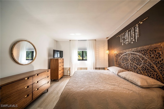 bedroom with light wood-style floors