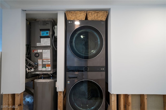 washroom featuring stacked washer and dryer and laundry area