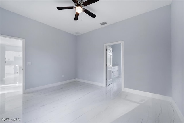 spare room with ceiling fan