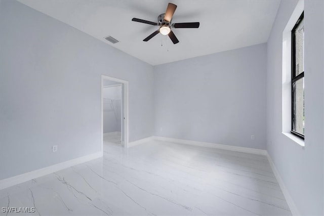 empty room featuring ceiling fan