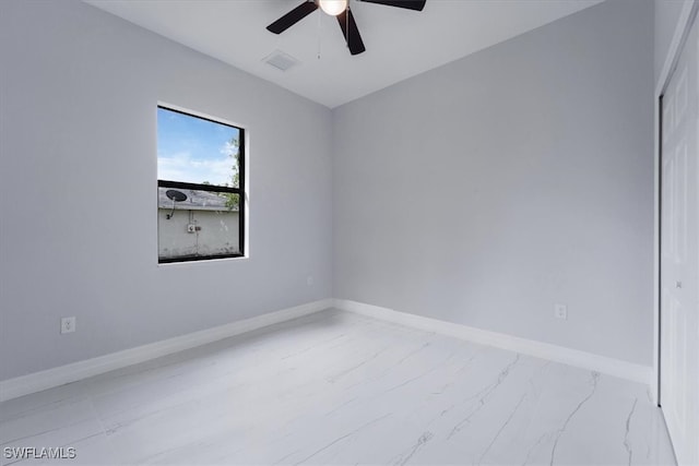 spare room with ceiling fan