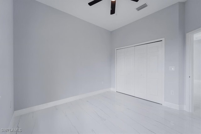 unfurnished bedroom with a closet and ceiling fan