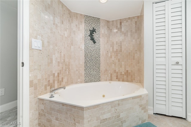 bathroom featuring tile walls, a relaxing tiled tub, and tile patterned flooring