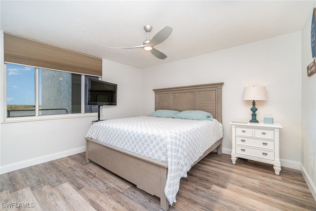 bedroom featuring ceiling fan and light hardwood / wood-style flooring