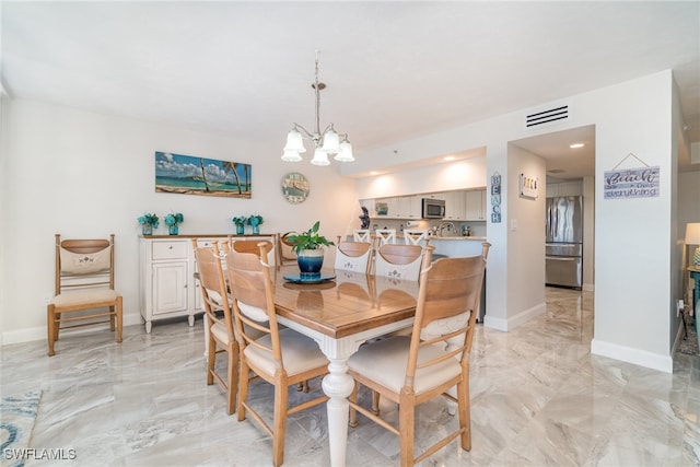 dining area with a notable chandelier